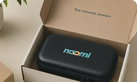 The Noomi device arriving in its travel case inside the shipping box