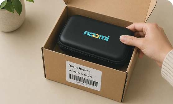 Packing the Noomi device back into its box to return after the trip